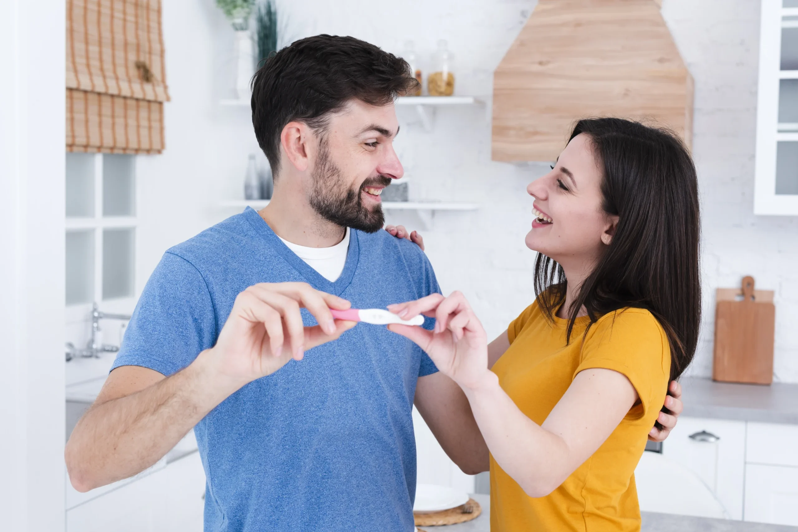 happy-couple-showing-off-pregnancy-test